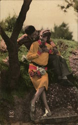 A Man and Woman resting on a hill Postcard Postcard Postcard