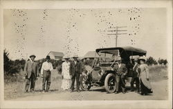 Men and Women Posing in Front of Automobile Postcard