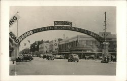 Street Scene and Welcome Arch Postcard