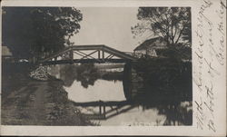 Reflections: Mirror Image of Bridge and Trees in Water Postcard