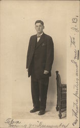 Young Man in Dark Suit Standing Near Furniture Men Postcard Postcard Postcard