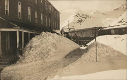 Building Near Mountains with Snow-Covered Walkway Shoveled Out Buildings Postcard Postcard Postcard