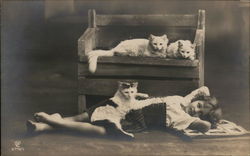 Young Girl Reclining on Floor with Three Cats Postcard