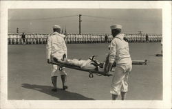 Two Sailors Carrying a Sailor on a Stretcher Postcard