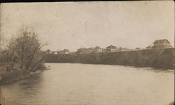 River Running by Houses Postcard