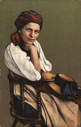 Woman Wearing Bandana Seated in Wooden Chair, Hat in Lap Postcard