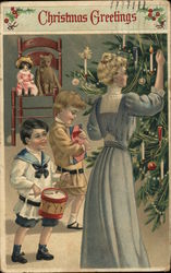 Woman at Christmas Tree with Two Children Postcard