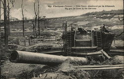 Large Cannon Sticking out of Ground with Desolate Countryside World War I Postcard Postcard