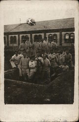 Large group of uniformed men - POWs? Postcard