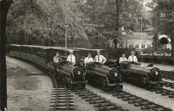 Six Men Riding Small Trains Postcard