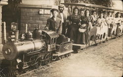 A Large Group of People on a Small Train Postcard