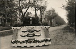 A Woman Riding on a Parade Float Postcard