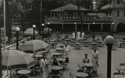 Beer Gardens Building, Tables and Umbrellas in Front Postcard