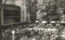 A Stage with Performers and an Audience Postcard