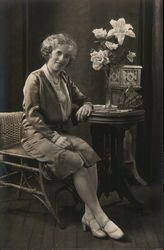 Woman Seated at Table Postcard