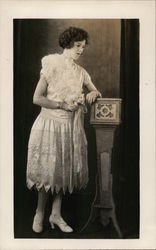 Woman in Frilly Dress Leaning on Podium Benton Harbor, MI House of David Postcard Postcard Postcard