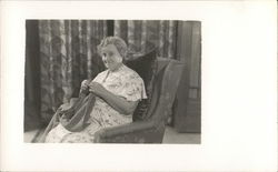 A Woman Sitting in a Chair Knitting House of David Postcard Postcard Postcard