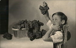 A Boy Holding Bunches of Grapes House of David Postcard Postcard Postcard