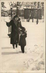 A Woman and Child Playing in the Snow Benton Harbor, MI House of David Postcard Postcard Postcard