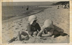 Two Young Children Playing on a Beach Postcard