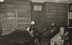 Man and Woman Seated in Library Room Benton Harbor, MI House of David Postcard Postcard Postcard