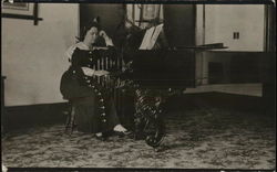 A Woman Sitting at a Piano House of David Postcard Postcard Postcard