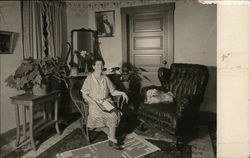 Woman Seated in Chair, Dog in Chair Next to Her Benton Harbor, MI House of David Postcard Postcard Postcard