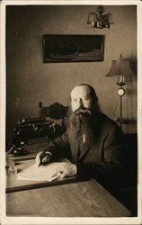 Bearded Man Seated with Pen and Paper Near Typewriter Benton Harbor, MI House of David Postcard Postcard Postcard