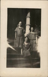 Three Girls Sitting on a Porch Postcard