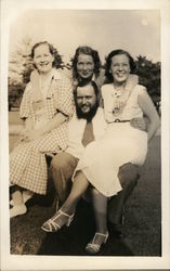 Three Men Sitting on a Man's Lap Postcard