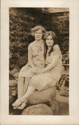 Two Young Women Seated Close Together Postcard