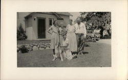 People Standing in Front of House with Boy & Dog Postcard