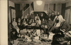 House of David Member Group Indoors With Gifts Displayed Postcard