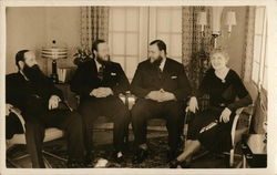 Dewhirst Family - Three Men in Suits, Woman in Black Dress Postcard