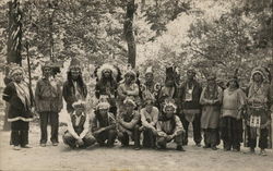 A Group of People Wearing Indian Headdresses Postcard