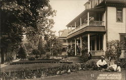 Two Men in a Yard in Front of a House Benton Harbor, MI House of David Postcard Postcard Postcard