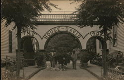 People and a Dog Beneath House of David Arch, 1906 Benton Harbor, MI Postcard Postcard Postcard