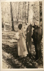 Two People Looking at a Tree Postcard