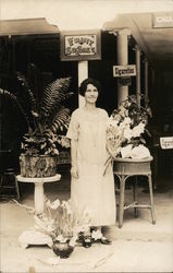 A Woman Holding Flowers Postcard