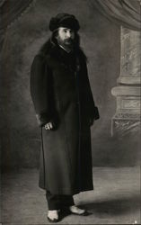 Man in Long Coat and Hat Postcard