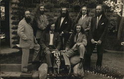 Five Men Standing,Two Seated with Eden Springs Pennant Postcard