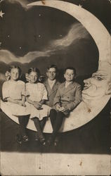 Three Children, One Adult Posed on Crescent Moon Moons Postcard Postcard Postcard