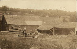 Men Cutting Logs on Farm Postcard