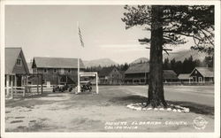 Houses, Automobiles with Mountains in Background - Eldorado County Meyers, CA Postcard Postcard Postcard