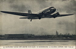 Mainliner Taking Off, Empire State Building in Background - La Guardia Airport New York, NY Postcard Postcard Postcard