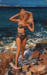 "Beachcomber," Woman in Swimsuit Standing on Rocky Shore Postcard