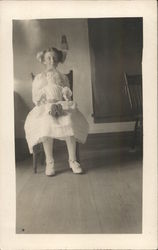 Snapshot of Girl Holding Doll Postcard