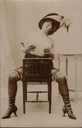 Topless Female in Garters, High-Heeled Boots, Seated and Holding Breasts Risque & Nude Postcard Postcard Postcard