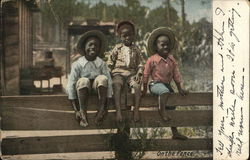 Three Black Boys on Fence Postcard