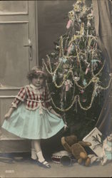 Little Girl in front of Christmas Tree Postcard